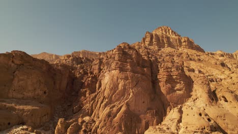 A-side-to-side-drone-shot-of-a-generic-big-desert-mountain,-great-as-a-transition-for-a-travel-vlog