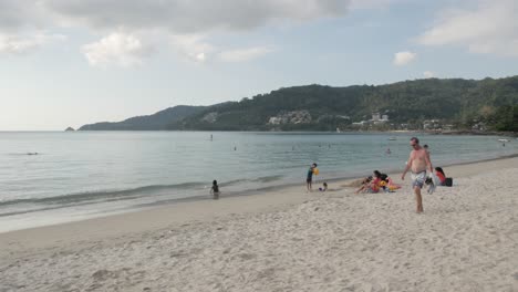 Patong-beach-with-many-people-relaxing-on-the-beach-while-in-covid19-omicron-outbreak-in-Phuket