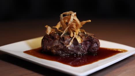 Beef-Tournedos-Rossini-Topped-With-Haystack-Onions-And-Demi-glace-Sauce