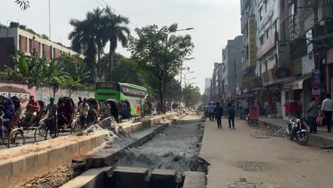 Street-construction-in-process-during-the-day-at-Dhaka,-Bangladesh