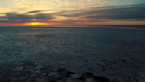 Cracked-Ice-Floating-In-The-Sea-At-Dusk-During-Winter