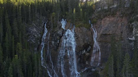 Set-of-waterfalls-in-the-middle-of-the-woods-of-Canmore,-Alberta,-Canada