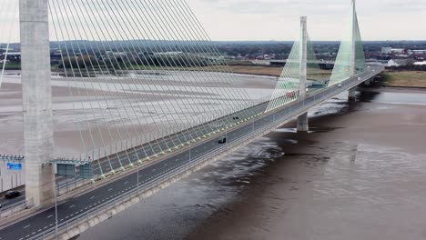 Mersey-gateway-landmark-aerial-view-above-toll-suspension-bridge-river-crossing-high-tracking-left-shot