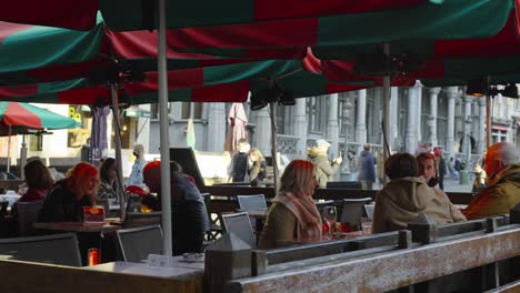 People-sit-on-open-air-terrace-at-Grand-Place-city-square-without-medical-masks-against-coronavirus