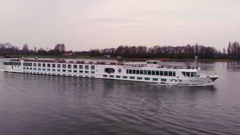 Aerial-Starboard-View-Of-River-Princess-Cruise-Ship-Along-Oude-Maas-With-Circle-Dolly-Around-Forward-Bow