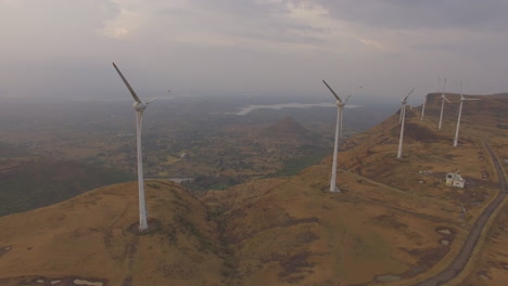 aerial-shot-of-halted-windmills-producing-no-energy-due-to-insufficient-wind-conditions