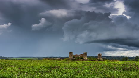 Historic-Brick-Structure-On-Green-Meadows-Over-Clouded-Sky