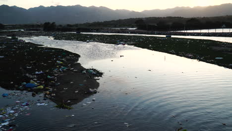 Majestic-Vietnam-landscape-and-garbage-filled-river-banks,-static-view