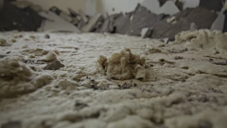 Close-up-shot-of-old-mineral-wool-under-floor-screed-in-an-old-building