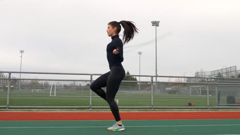 Sportive-Girl-Exercising-Outdoor-on-the-Track,-Warming-Up-Jumping-Rope