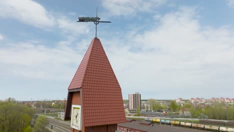 Train-station-tower-with-built-in-clock-and-lightning-rod-located-in-Klaipeda-city