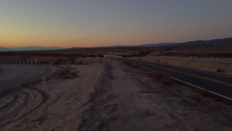 Single-Car-Driving-on-Freeway-in-Salton-Sea-Desert-California