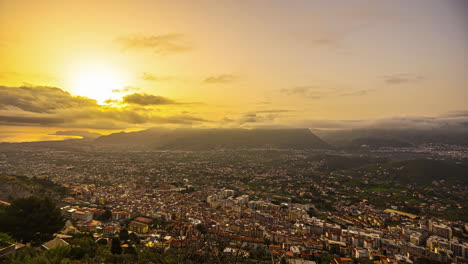 Static-shot-of-Palermo-city-on-the-foothills-of-a-mountain-range-along-with-mediterranean-sea-coast-from-city-Monreale,-Sicily,-Italy-during-sunset