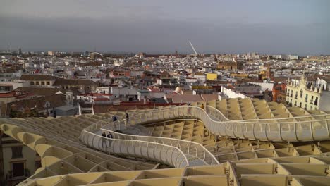 Tourists-enjoying-views-of-Seville-from-top-of-famous-Metropol-Parasol