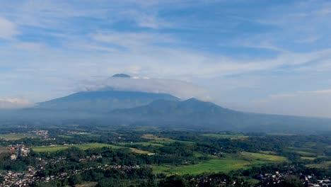 Clouds-pass-volcano-peak-of-Mount-Sumbing,-Java,-Indonesia,-time-lapse