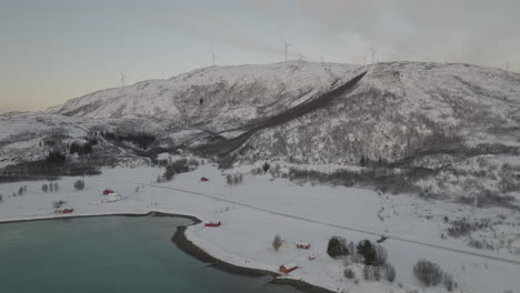 Wind-Turbine-Field-At-Top-Of-Snowy-Norwegian-Hills-Landscape,-Aerial