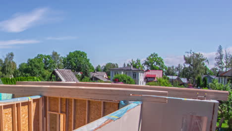 Timelapse-shot-of-industrial-worker-on-construction-site-build-new-wooden-rooftop-of-house-during-summer