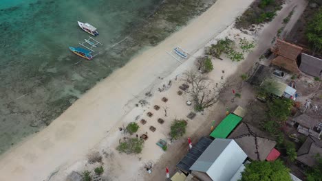 aerial-top-down-of-white-sand-beach-bar-on-Gili-Meno-Island-with-turquoise-water