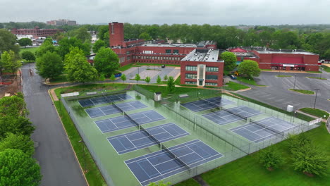 Aerial-rotation-around-tennis-courts-at-large-public-school