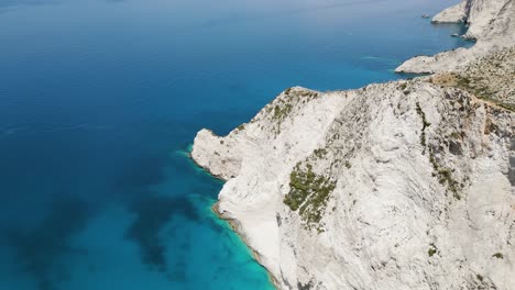 Calm-Blue-Sea-And-White-Rocky-Cliffs-Of-Ionian-Islands-In-Greece