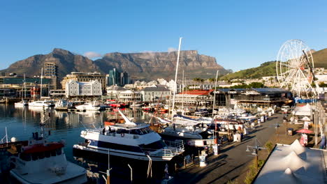 Elevated-view-over-Victoria-and-Alfred-Waterfront,-Table-Mountain-background