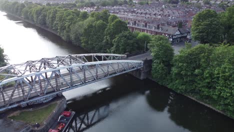 Aerial-view-Manchester-ship-canal-swing-bridge-Warrington-countryside-houses-England