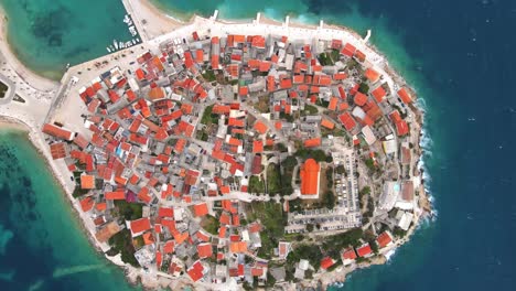 Aerial-drone-headshot-of-Primosten-old-town-on-the-islet,-Dalmatia,-Croatia