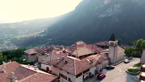 Aerial-ascending-shot-to-reveal-a-small-historic-town-in-the-Italian-Alps