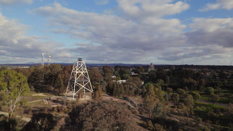 Wide-circling-drone-shot-of-Victoria-Hill-Mining-Reserve-poppet-head-in-Bendigo