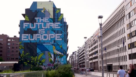 Timelapse-of-conceptual-mural-near-the-European-Institution-district-in-Brussels,-Belgium