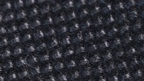 Black-absorbent-cloth,-macro-shot-close-up-view-with-fast-rotation-motion