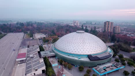 Aerial-view-of-the-large-and-famous-Movistar-arena-indoors-stadium-in-Santiago,-Chile