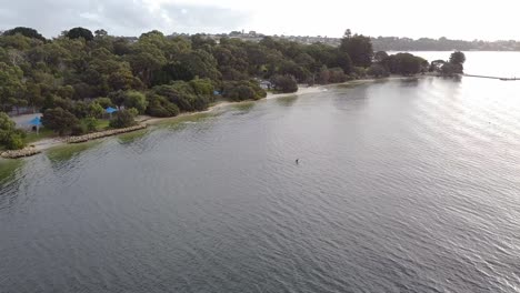 Aerial-View-Of-An-E-Foil-Rider-And-A-Kayaker,-Point-Walter,-Perth