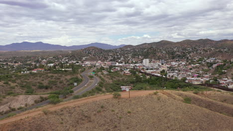 Drone-flies-over-hills-in-Nogales,-Arizona