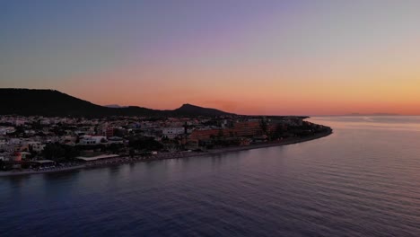 Sunset-Scenery-At-The-Coastal-Town-Of-Ialysos-On-Rhodes,-Greece---aerial-drone-shot