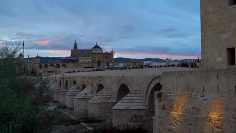 Stunning-sunset-scenery-over-stone-bridge-in-Cordoba,-Spain
