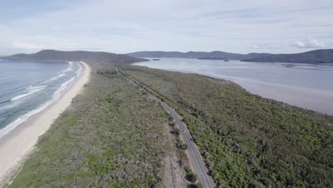 Tranquil-Scene-At-The-Lakes-Way-And-Seven-Mile-Beach-In-New-South-Wales,-Australia---aerial-drone-shot