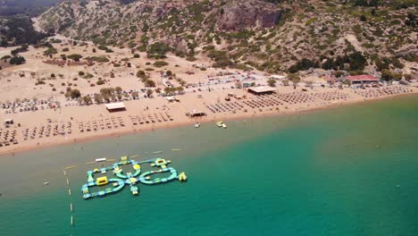 Inflatable-Water-Park-In-The-Sea-At-The-Tsambika-Beach-On-Rhodes-Island-In-Greece