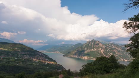 Timelpase-at-Lake-Iseo-and-Mount-Corna-Trentapassi-at-sunny-day-with-clouds
