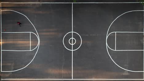 A-top-down-view-directly-above-a-basketball-court-in-a-park-on-Long-Island,-NY
