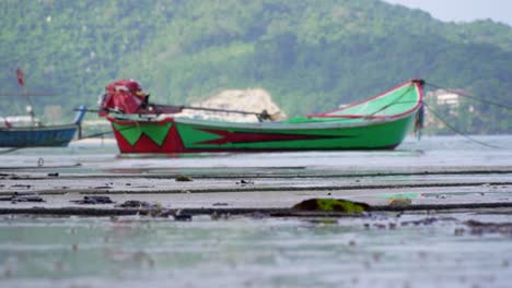 Footage-of-a-long-tail-boat-at-a-beach-in-phuket,-thailand