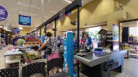 static-shot-shows-how-few-customers-are-at-the-checkout-of-a-huge-supermarket-after-the-covid-recession