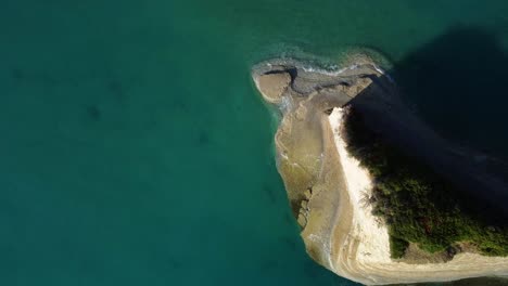 aerial-top-down-of-rock-formation-islet-in-corfu-island-pristine-clean-ocean-sea-water