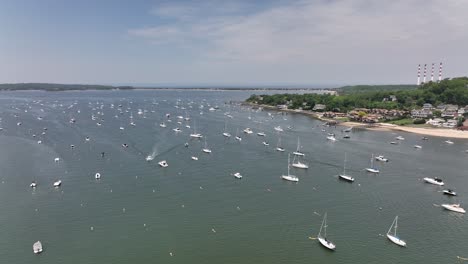 An-aerial-view-over-the-Northport-Marina-on-Long-island,-NY-with-many-anchored-boats
