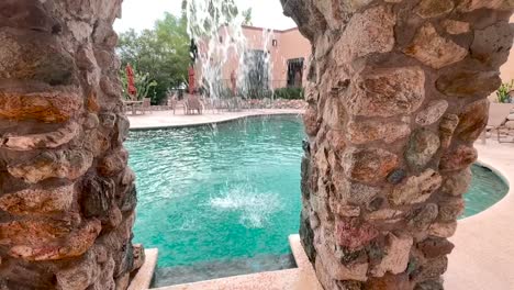 Pool-waterfall-in-slow-motion-at-Arizona-resort,-Tanque-Verde-Ranch