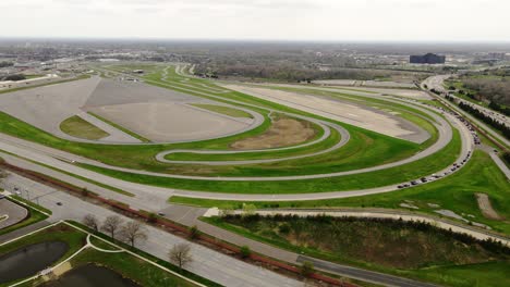 Aerial-Circling-shot-of-Ford-Dearborn-Proving-grounds,-Development-Center-and-Driving-Dynamics-Laboratory,-USA