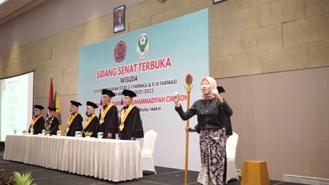 University-Dean-and-board-of-officials-giving-speech-at-final-diploma-graduation-ceremony,-by-singing-the-national-anthem