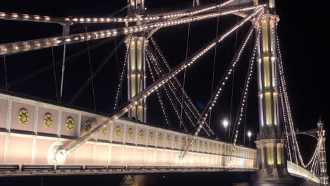 Close-up-view-of-the-iconic-Albert-bridge-illuminated-at-night-in-Chelsea