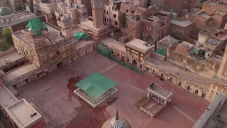 Drone-taken-aerial-video-of-the-courtyard-of-the-iconic-Masjid-Wazir-Khan-mosque-in-Lahore,-Pakistan