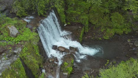 River-Forest-Dam-and-Waterfall,-Aerial-Pan-Shot,-Daisen,-Tottori-Japan